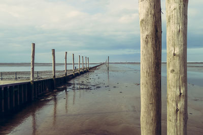 Pier over sea against sky