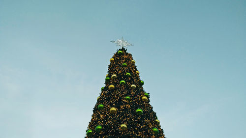 Low angle view of christmas tree against clear sky