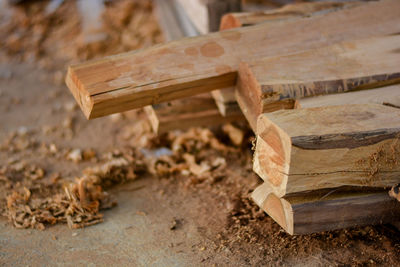 Close-up of wooden bench on field