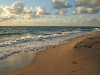 Scenic view of beach against sky