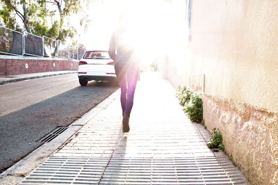 Full length of man on footpath in city