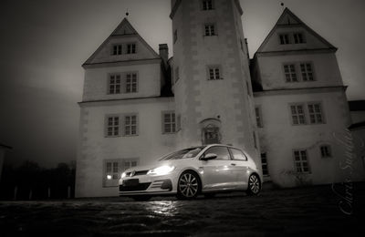 Car on street against building at night