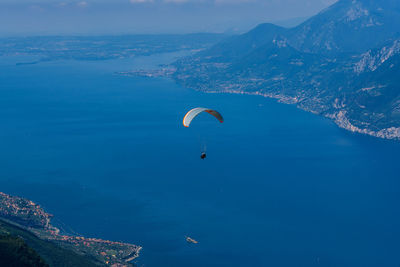 Paragliding from monte baldo over lake garda in italy.