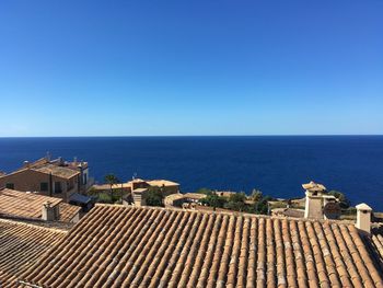 High angle view of sea against clear blue sky