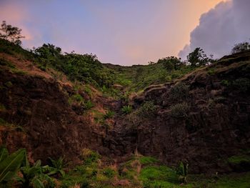 Scenic view of rocky mountains against sky during sunset