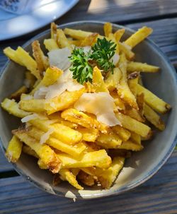 Fremch fries in plate on table