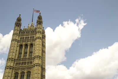 Low angle view of clock tower against sky in city