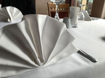 Napkins and knife on restaurant table