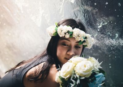 Close-up of woman holding flower