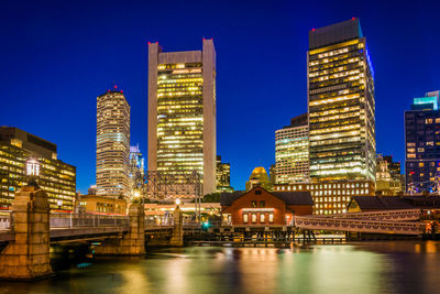 Illuminated buildings in city at night