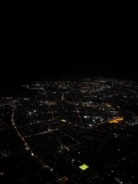 High angle view of illuminated buildings in city at night