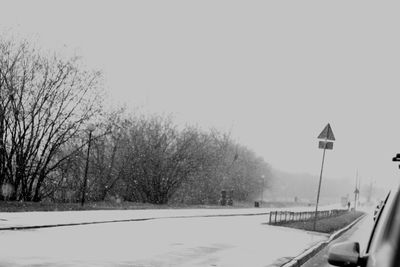 Road passing through snow covered landscape