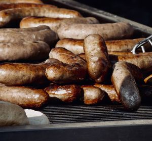 Close-up of sausages on barbecue grill