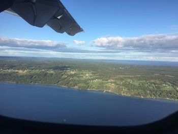 Cropped image of airplane flying over landscape