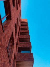 Low angle view of building against blue sky