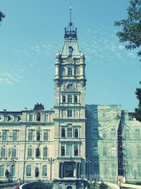 Low angle view of clock tower against sky