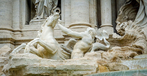 Low angle view of statue against building