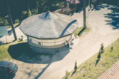 High angle view of playground by trees on sunny day