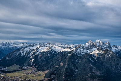 Scenic view of snowcapped mountains against sky