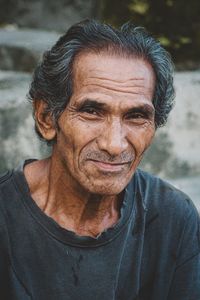 Close-up portrait of young man looking away