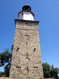 Low angle view of tower against clear blue sky