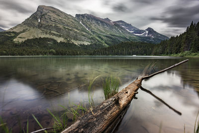 Scenic view of mountains reflecting on calm lake