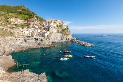 View of village houses  and sea bay of  manarola village at cinque terre area,  italy,  june, 2019.