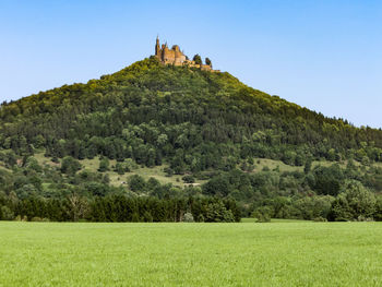 Scenic view of land against clear sky