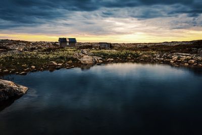 Scenic view of lake against sky during sunset