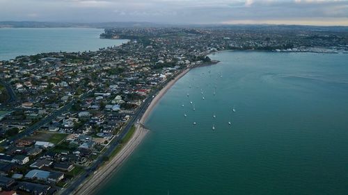 High angle view of city by sea