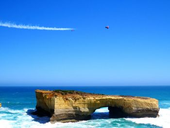 Scenic view of sea against clear blue sky
