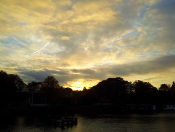 Scenic view of cloudy sky at sunset