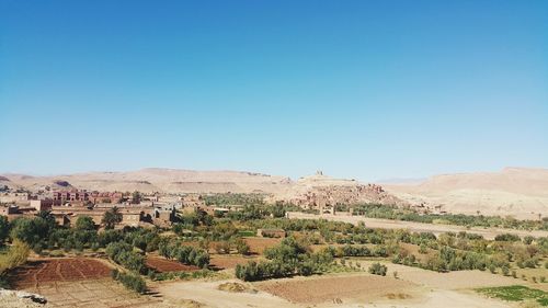 Scenic view of landscape against clear blue sky