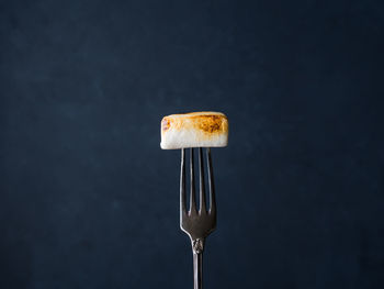 Close-up of cupcakes against black background