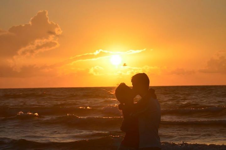 sea, sunset, horizon over water, water, beach, sky, silhouette, scenics, lifestyles, standing, beauty in nature, leisure activity, orange color, shore, tranquil scene, sun, tranquility, rear view