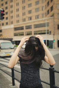 Woman standing in city