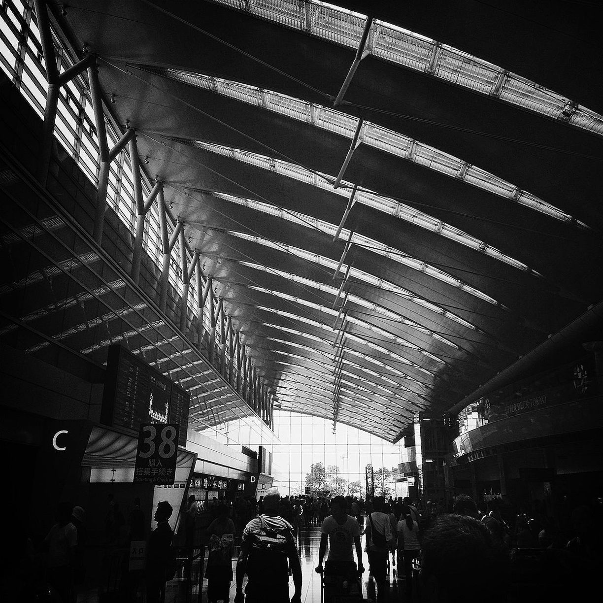 large group of people, men, person, lifestyles, indoors, architecture, built structure, leisure activity, illuminated, crowd, walking, railroad station, city life, ceiling, travel, mixed age range, group of people, shopping mall, night