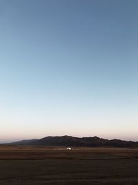 Scenic view of landscape against clear sky