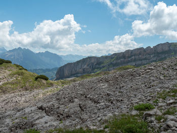 Scenic view of landscape and mountains against sky