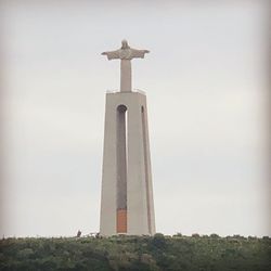 Low angle view of statue against sky