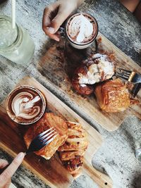 High angle view of coffee cup on table with croissan party