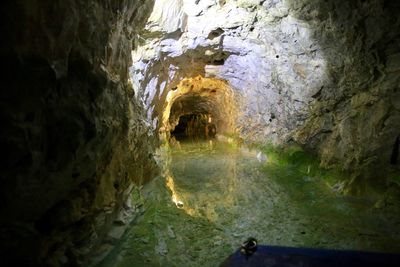 Reflection of cave in water