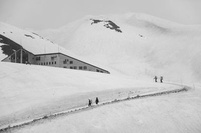 Scenic view of snow covered mountain against sky
