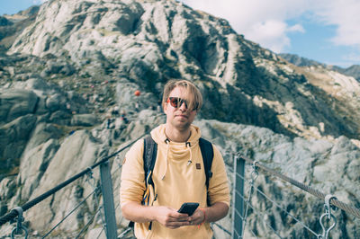 Portrait of woman standing on mountain