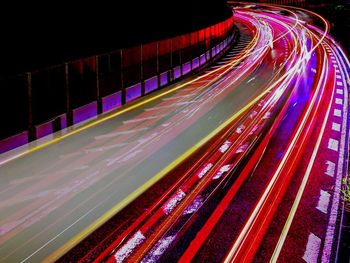 High angle view of light trails on road at night