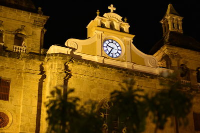 Low angle view of bell tower at night