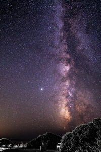 Scenic view of star field against sky at night