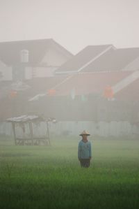 Man on field during foggy weather