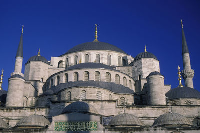 Low angle view of a building against blue sky