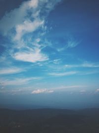 Scenic view of landscape against cloudy sky